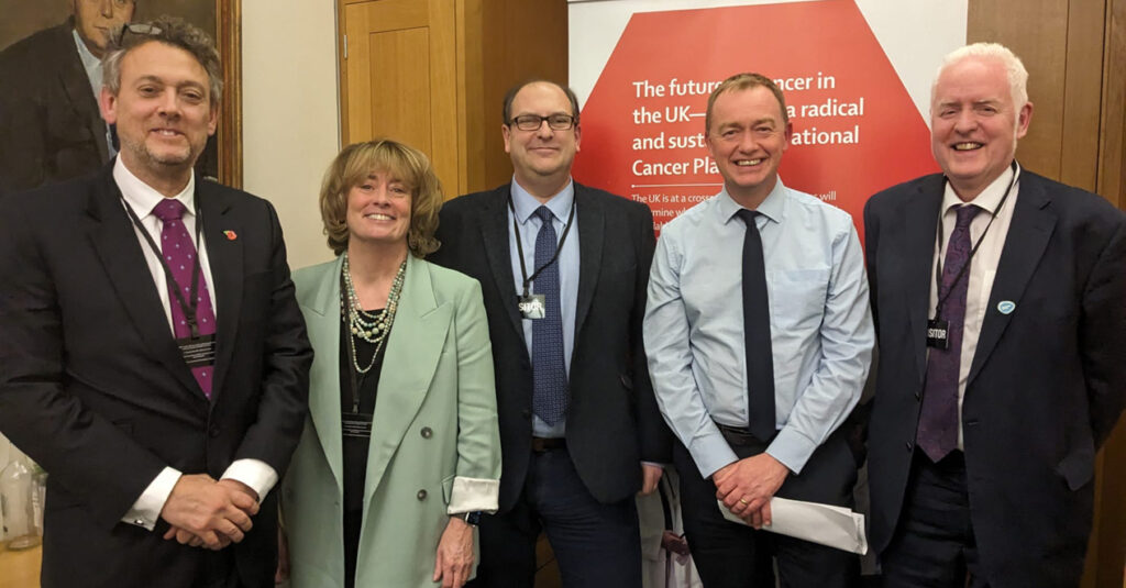 Richard Sullivan, Pat Price, David Collingridge, Tim Farron, & Mark Lawler posing for photo at London Global Cancer Week